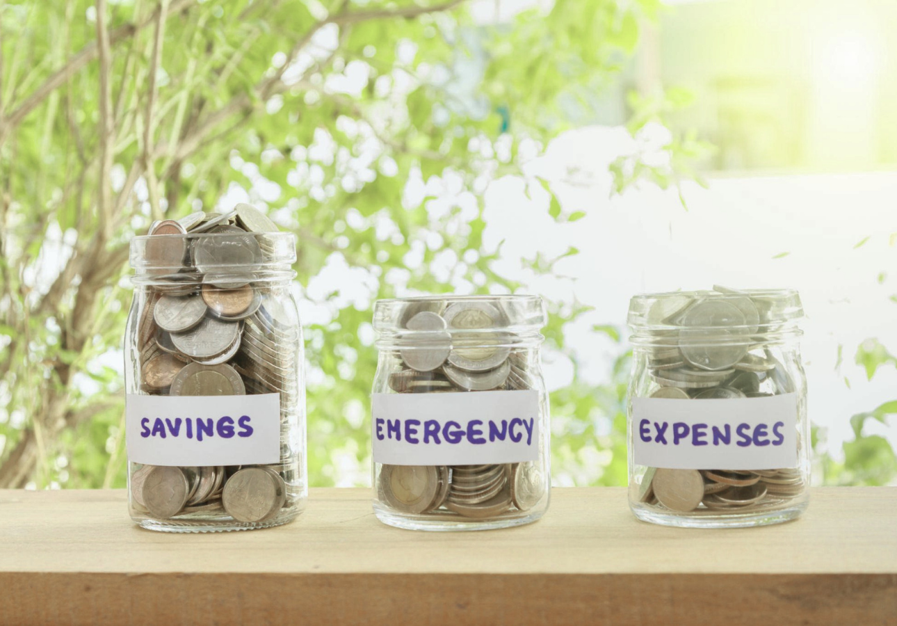 Three glass jars labelled Savings, Emergency, and Expenses — build your financial foundation before investing