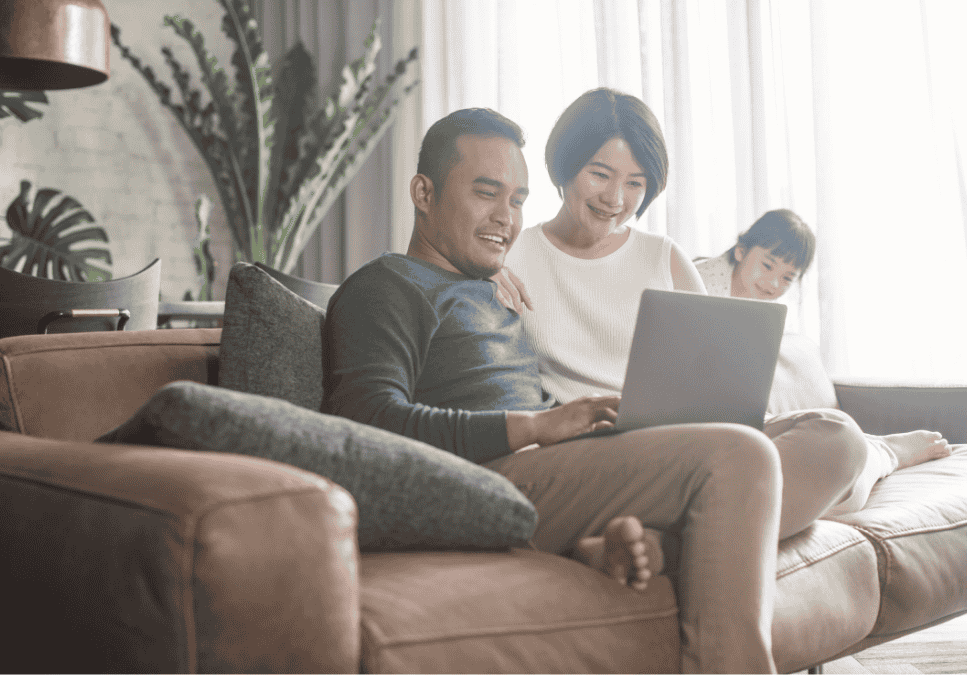 Family sitting together reviewing finances at home, representing RRSP planning for Canadians