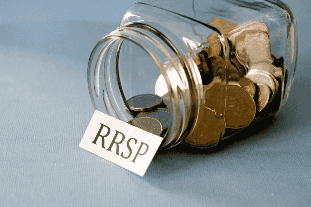 Jar labeled RRSP filled with Canadian coins representing tax-deferred savings