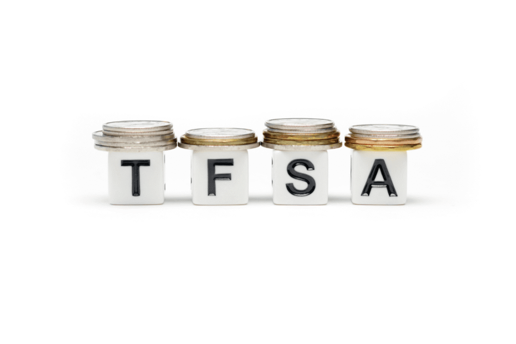 Stacked jars labeled TFSA with coins representing tax-free savings growth