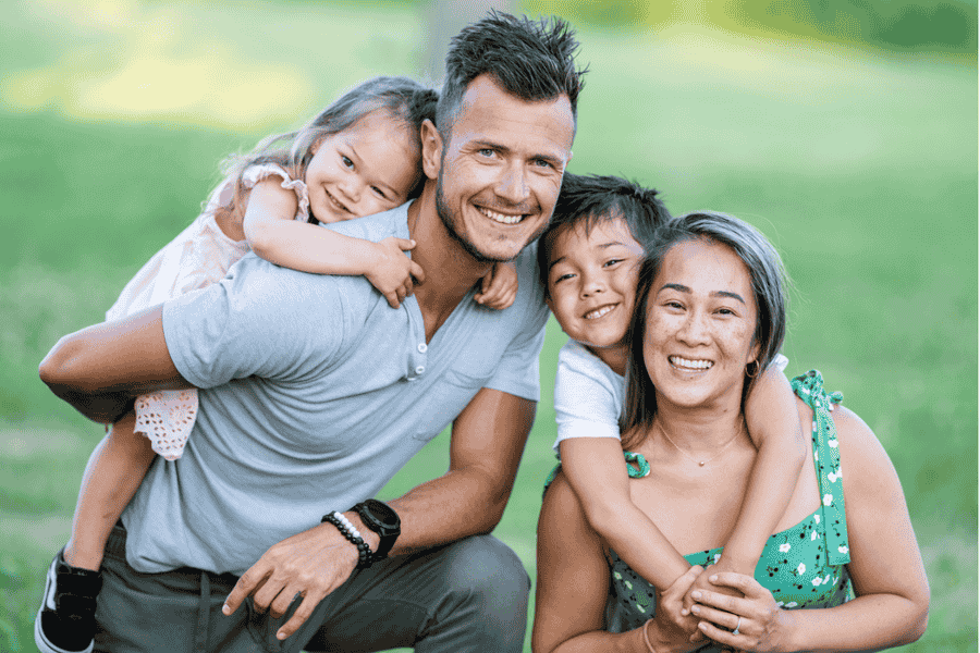 Happy young family outdoors, representing Canadian parents planning for their future