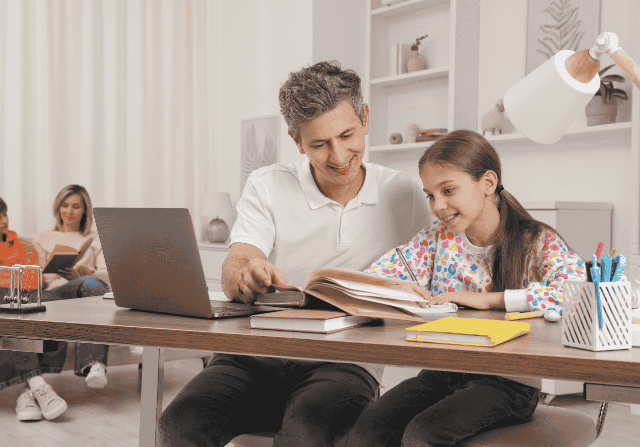 Parent helping their child study at home with a laptop, illustrating how RESPs in Canada help families save for post-secondary education