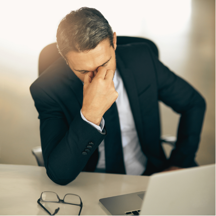 Man looking stressed at laptop after missing RRSP deadline in Canada.