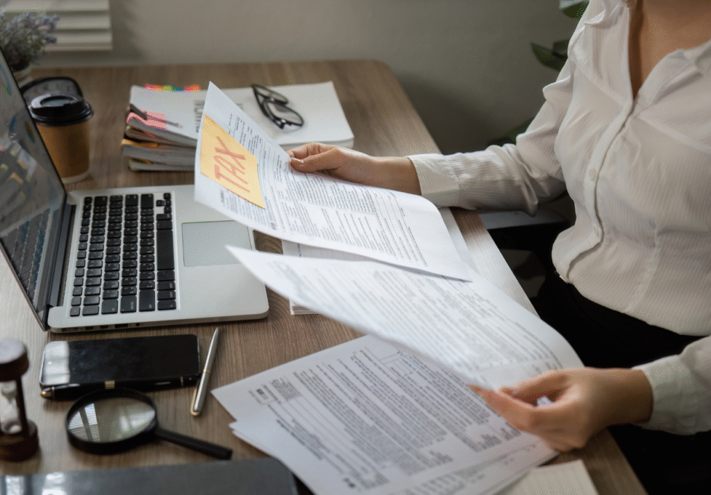 Woman reviewing tax documents at desk during Canadian tax filing season