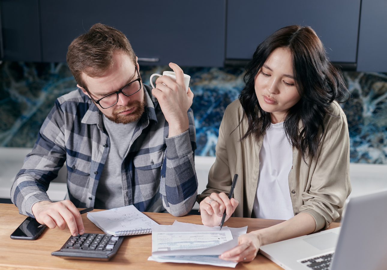 Canadian couple reviewing their automated bank account budget together